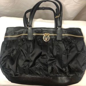 HENRI BENDEL Vintage handbag. Black satin and leather handbag with padlock.
